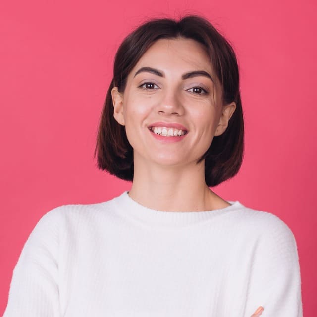 beautiful-woman-casual-white-sweater-with-crossed-hands-smile (1)