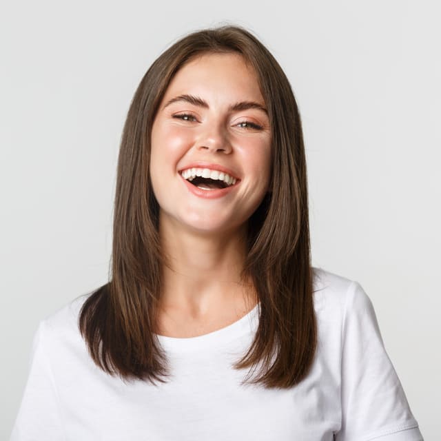 close-up-happy-brunette-girl-white-t-shirt-laughing-smiling-carefree-camera (1)
